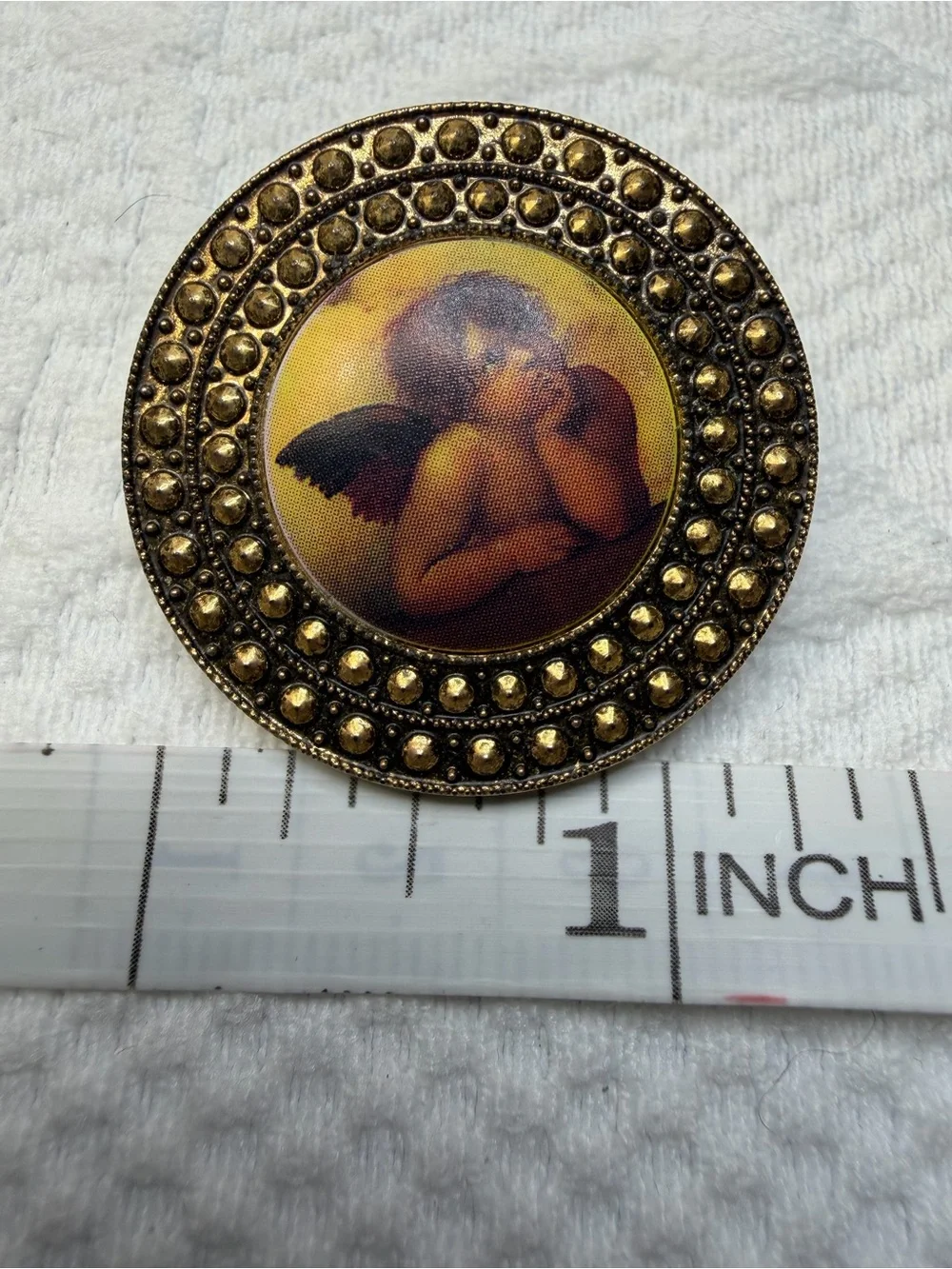 Vintage Gold-Tone Cherub Brooch with Yellow and Brown Accents